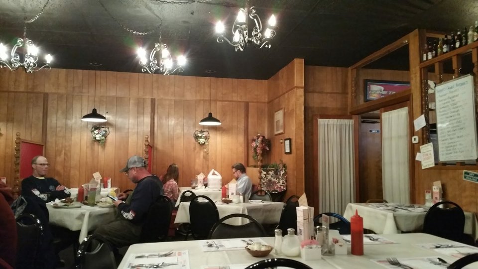 Casual restaurant interior with table service.